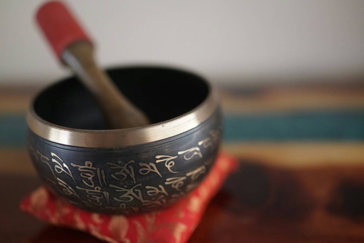 A person practicing Zen meditation under a tree.