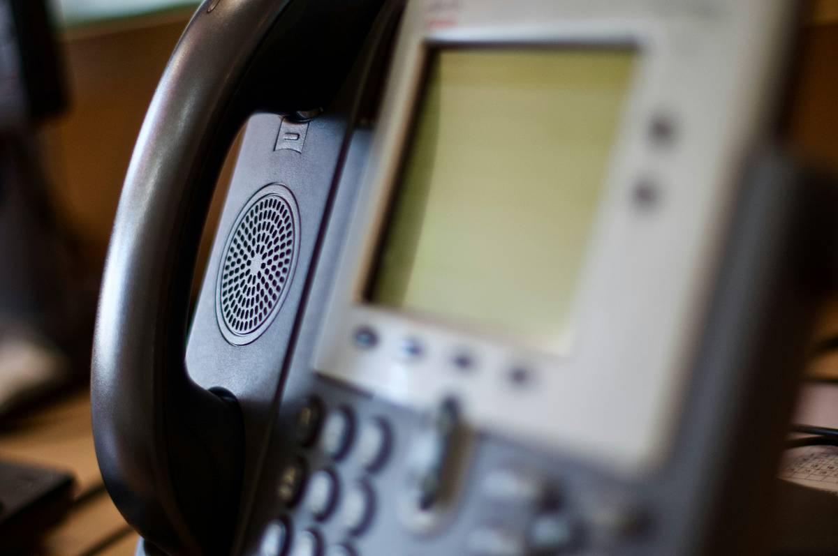 Diagram showing how business phone API connects VoIP system to CRM, helpdesk, and analytics tools via RESTful endpoints